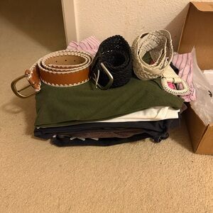 bundle of clothes (tops & bottoms) and 3 belts